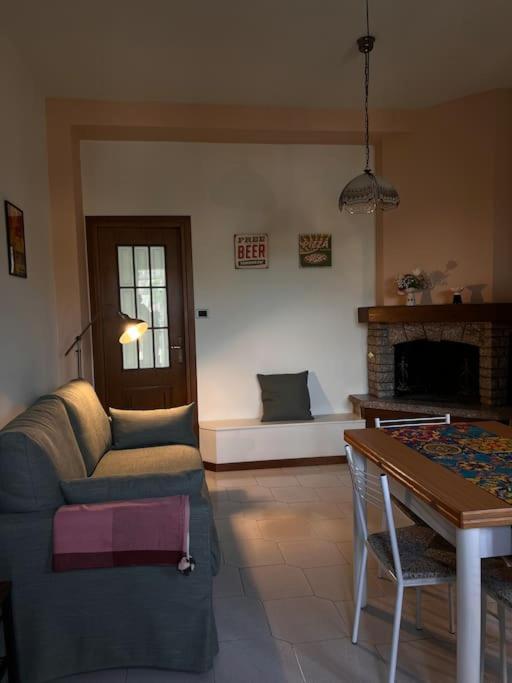 a living room with a couch and a table at Casa di Fausto - CityLife Apartment in Milan
