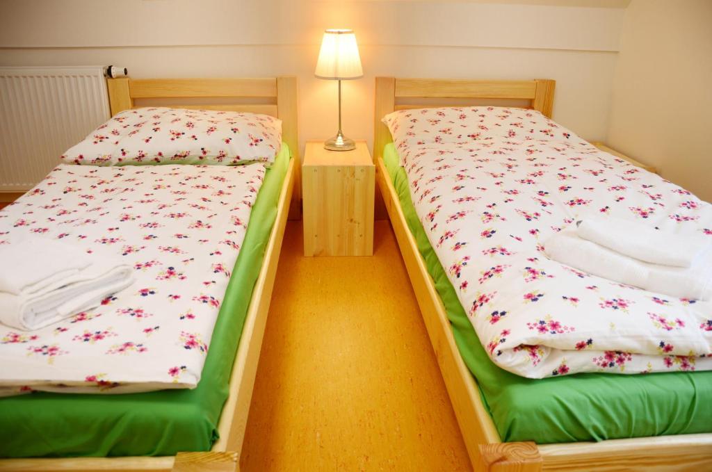 Postel nebo postele na pokoji v ubytování Mezi Stromy