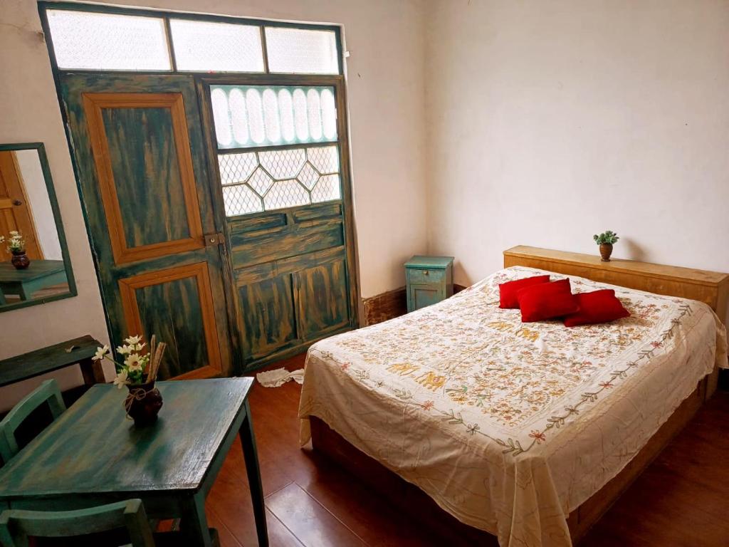 Ένα ή περισσότερα κρεβάτια σε δωμάτιο στο Rinconcito Andino