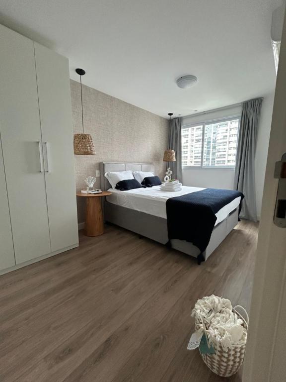 Ένα ή περισσότερα κρεβάτια σε δωμάτιο στο Apto RioCentro, Parque Olímpico Barra da Tijuca RJ