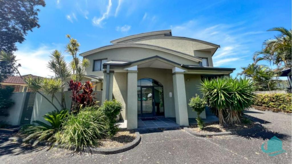 a house with a round roof at Beachside Beauty in Caves Beach