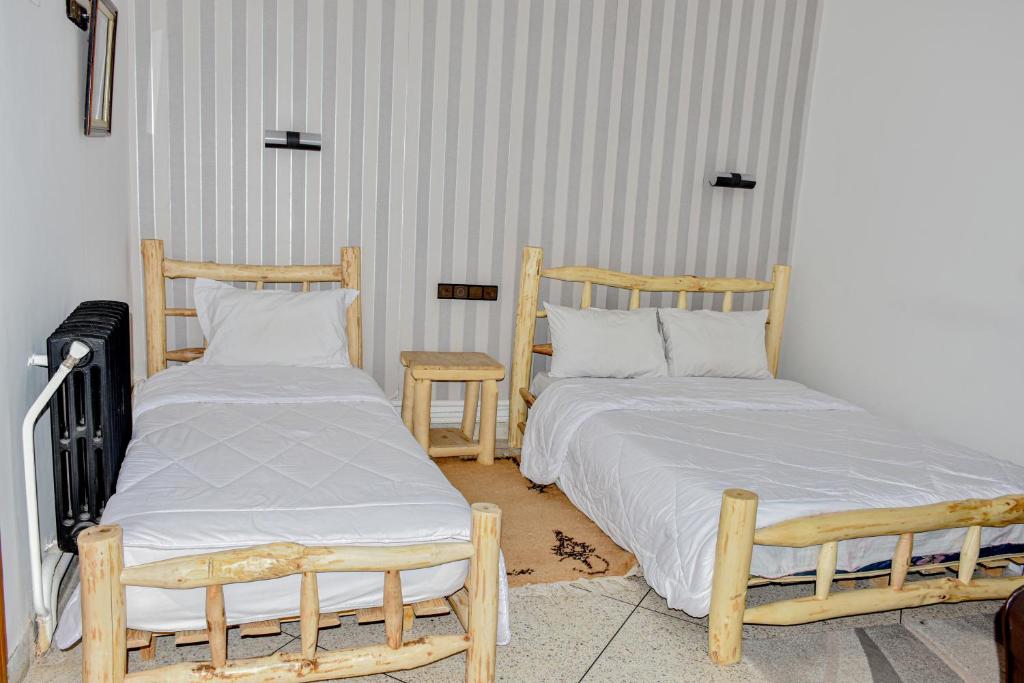 Postel nebo postele na pokoji v ubytování Hotel Safari Week end