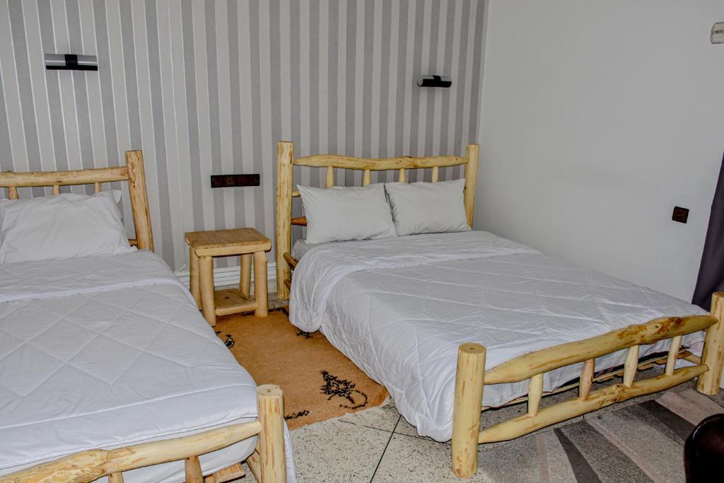Postel nebo postele na pokoji v ubytování Hotel Safari Week end