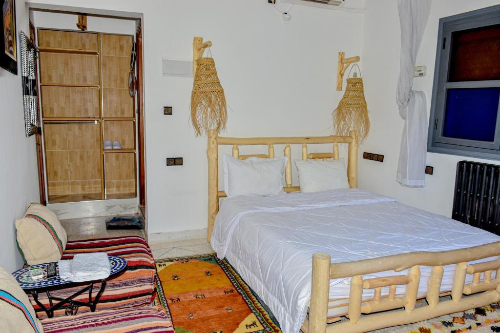 Postel nebo postele na pokoji v ubytování Hotel Safari Week end