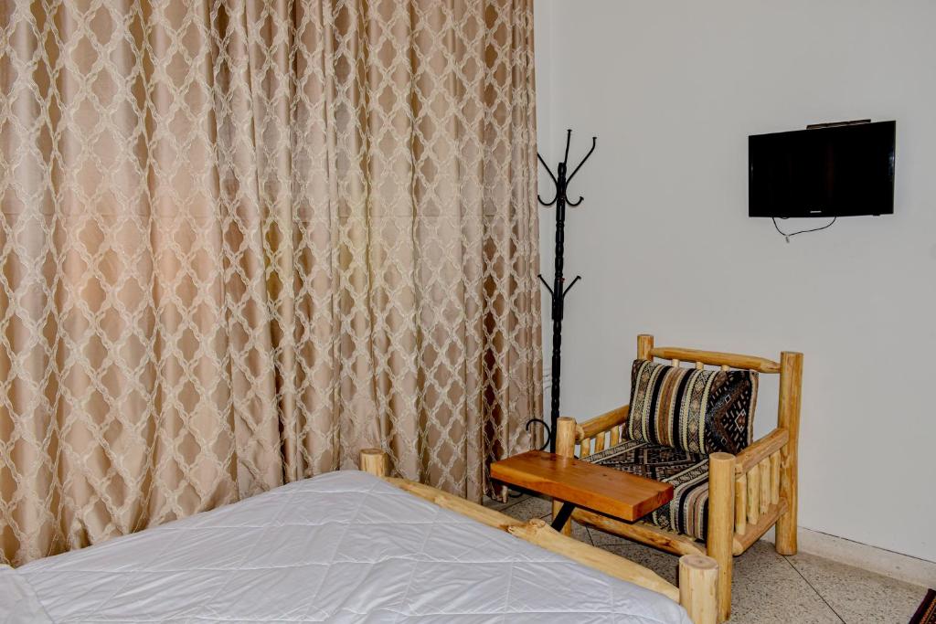 TV a/nebo společenská místnost v ubytování Hotel Safari Week end