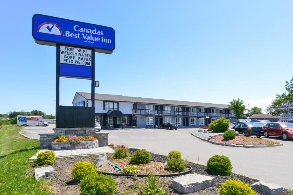 a sign for a best value inn in front of a parking lot at Canadas Best Value Inn St. Catharines in St. Catharines