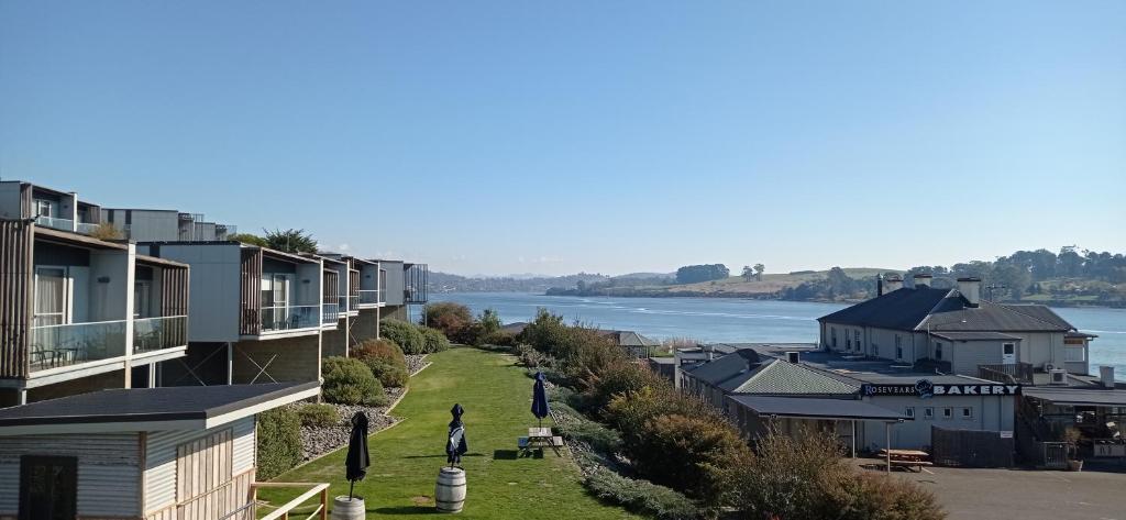 a view of a town with a river and houses at Rosevears Riverview Hotel in Rosevears