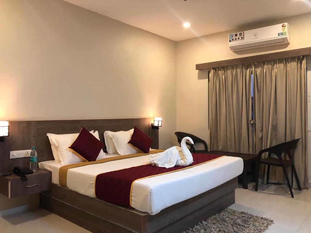 Ліжко або ліжка в номері Hotel Rameswaram KNP Nest