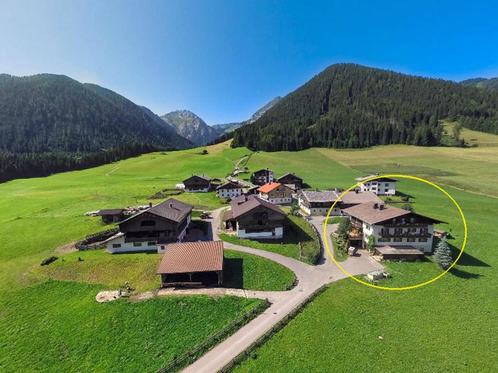 an aerial view of a village in a green field at Haus Renate in Kartitsch