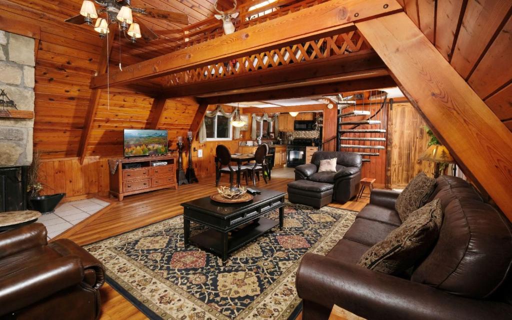 a living room with a couch and a table at Shepherds Crook 1127 in Gatlinburg
