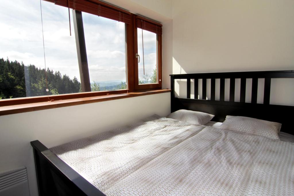 Postel nebo postele na pokoji v ubytování Apartmány Chata Švadlenka