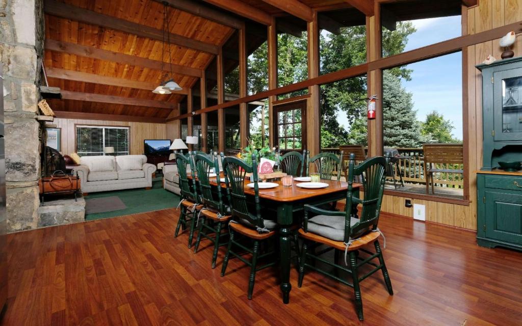 a dining room with a table and chairs at Three Pines 2139 in Gatlinburg