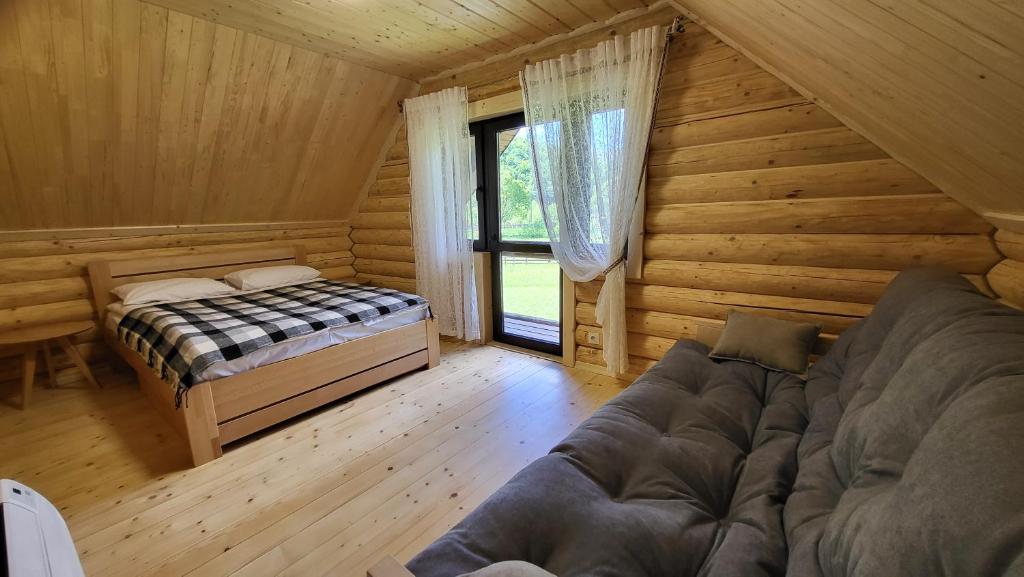 Postel nebo postele na pokoji v ubytování Котеджі Карпати Fest