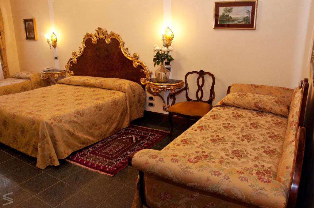 Postel nebo postele na pokoji v ubytování Residenza d'Epoca San Cassiano