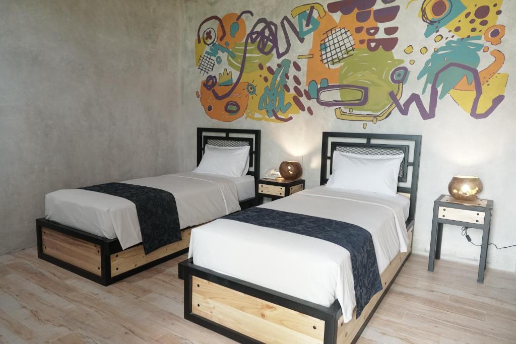 Postel nebo postele na pokoji v ubytování Hotel New Puri Garden