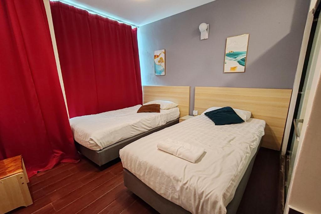 Postel nebo postele na pokoji v ubytování Hotel 18 DIMILIKI OLEH HOTEL MY HOME STATION 18 SDN BHD
