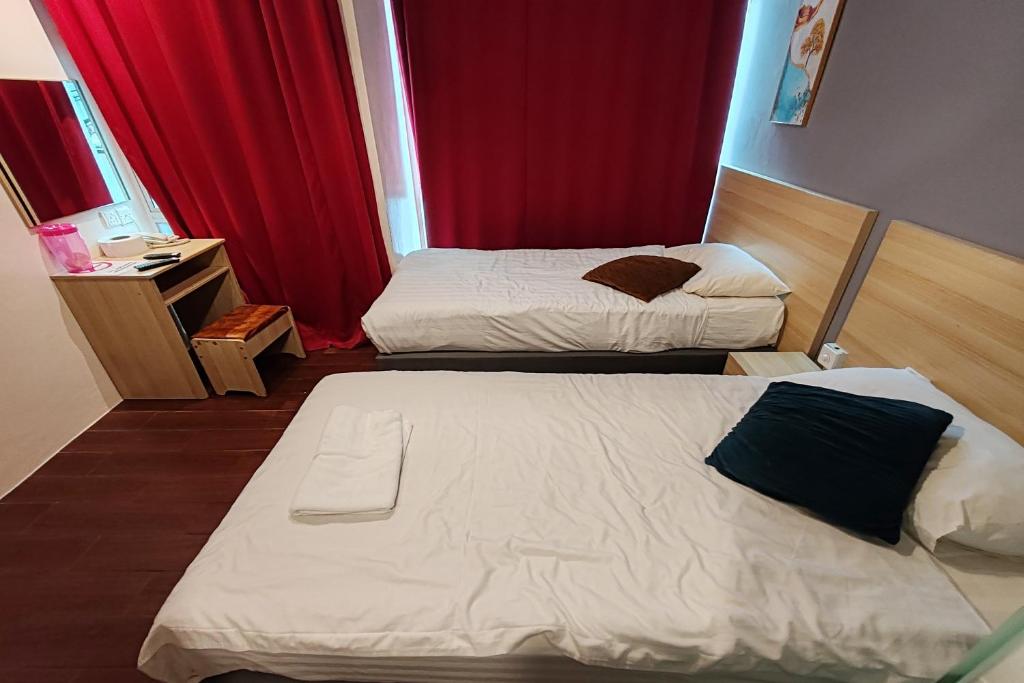 Postel nebo postele na pokoji v ubytování Hotel 18 DIMILIKI OLEH HOTEL MY HOME STATION 18 SDN BHD