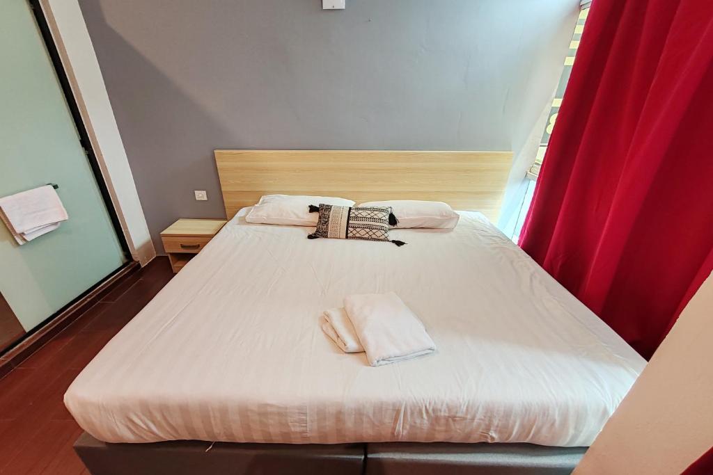 Postel nebo postele na pokoji v ubytování Hotel 18 DIMILIKI OLEH HOTEL MY HOME STATION 18 SDN BHD