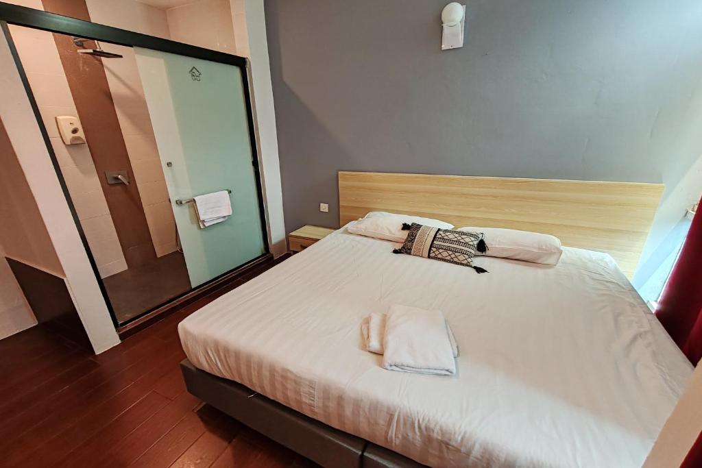 Postel nebo postele na pokoji v ubytování Hotel 18 DIMILIKI OLEH HOTEL MY HOME STATION 18 SDN BHD