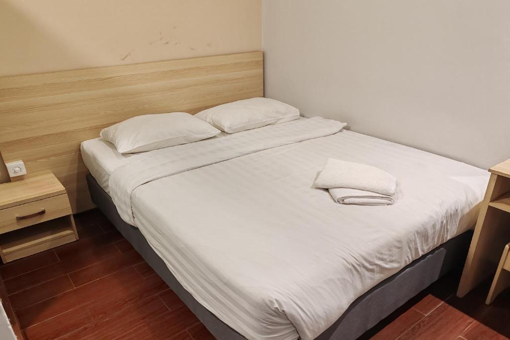 Postel nebo postele na pokoji v ubytování Hotel 18 DIMILIKI OLEH HOTEL MY HOME STATION 18 SDN BHD