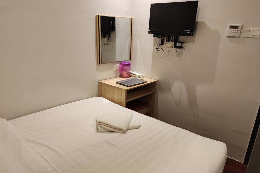 Postel nebo postele na pokoji v ubytování Hotel 18 DIMILIKI OLEH HOTEL MY HOME STATION 18 SDN BHD