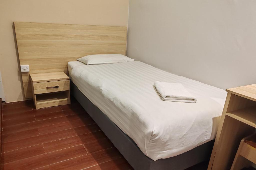 Postel nebo postele na pokoji v ubytování Hotel 18 DIMILIKI OLEH HOTEL MY HOME STATION 18 SDN BHD