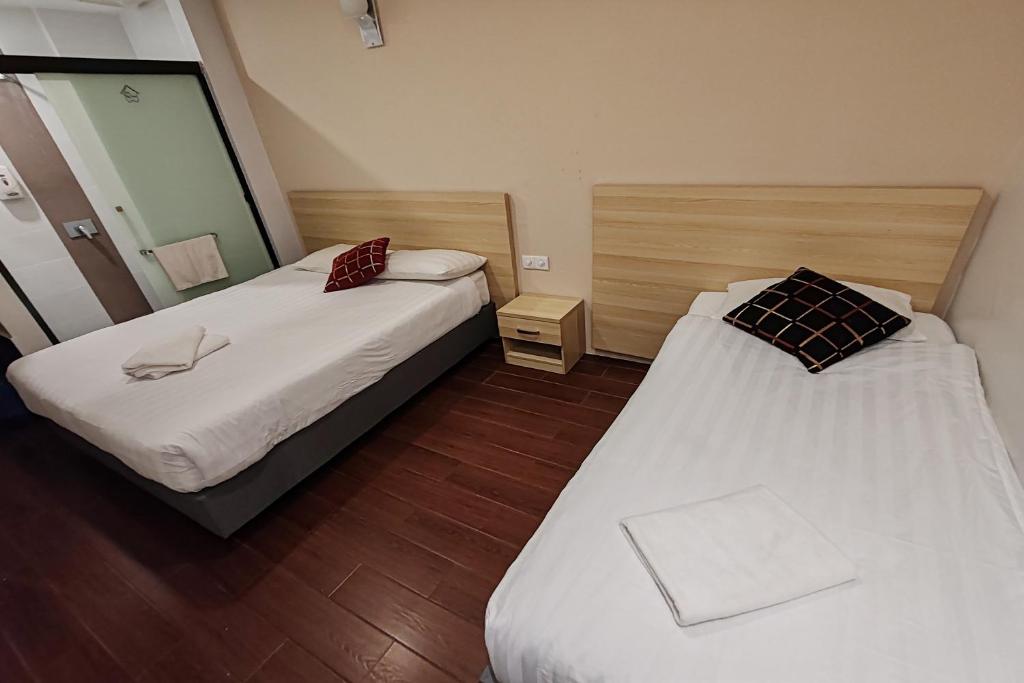 Postel nebo postele na pokoji v ubytování Hotel 18 DIMILIKI OLEH HOTEL MY HOME STATION 18 SDN BHD