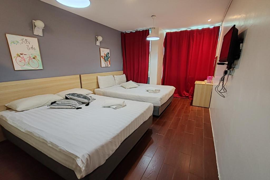 Postel nebo postele na pokoji v ubytování Hotel 18 DIMILIKI OLEH HOTEL MY HOME STATION 18 SDN BHD