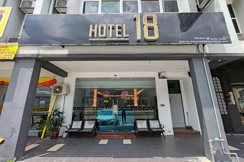 a hotel sign on the front of a building at Hotel 18 in Ipoh