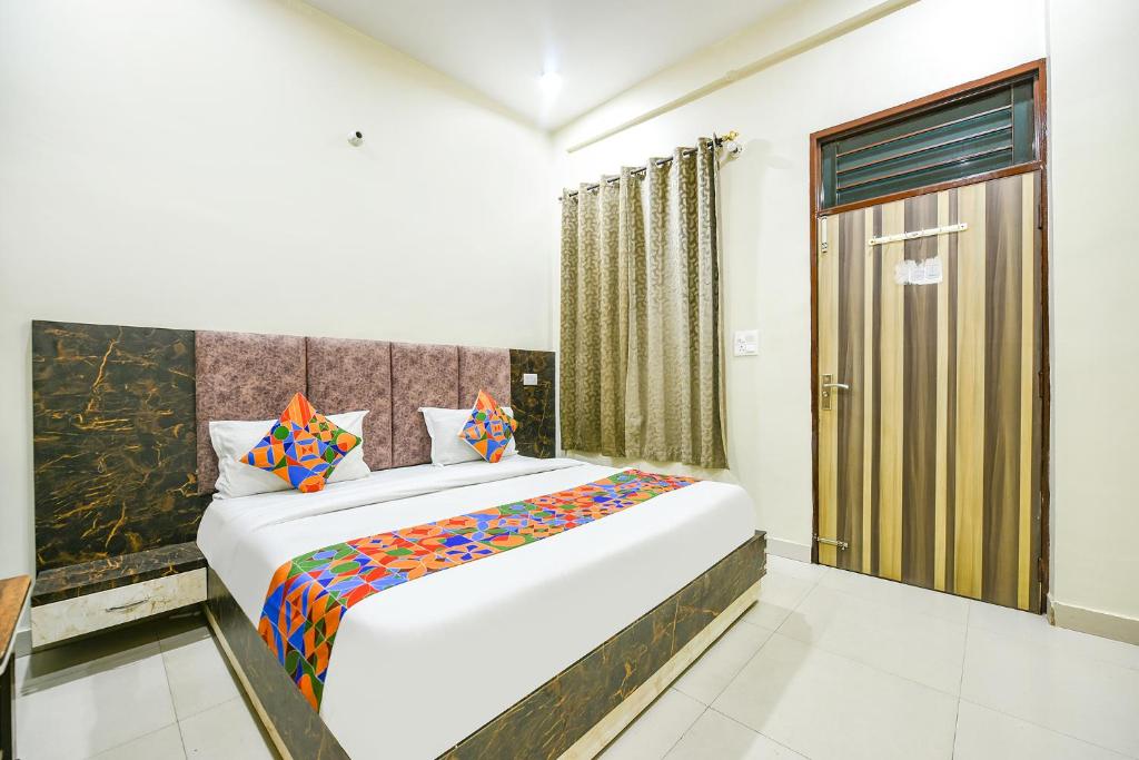 a bedroom with a large bed in a room at Via Galaxy in Chandīgarh