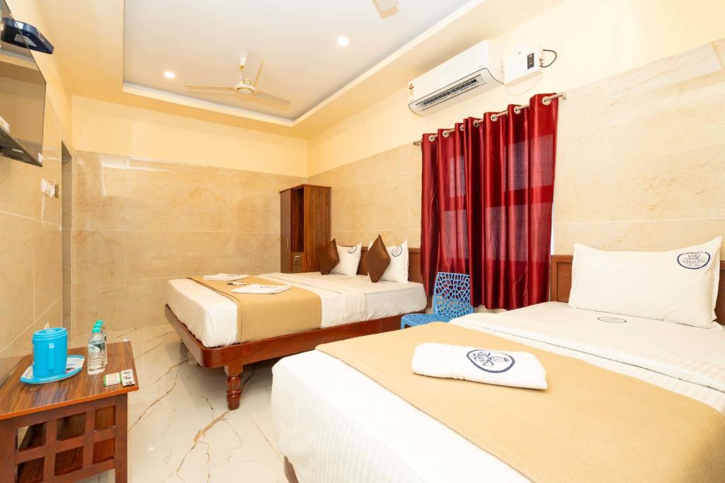 Hotel Amman Residency tesisinde bir odada yatak veya yataklar