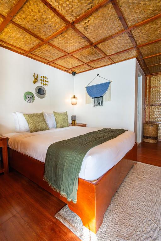 Postel nebo postele na pokoji v ubytování Beach Huts El Nido