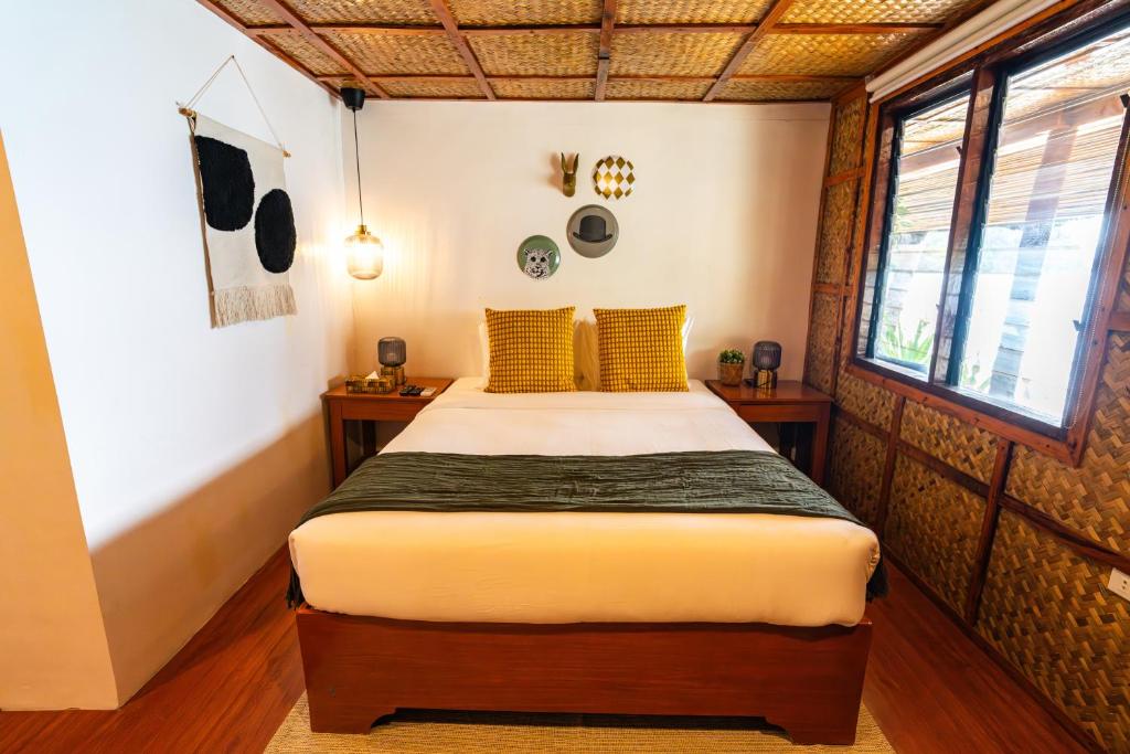 Postel nebo postele na pokoji v ubytování Beach Huts El Nido