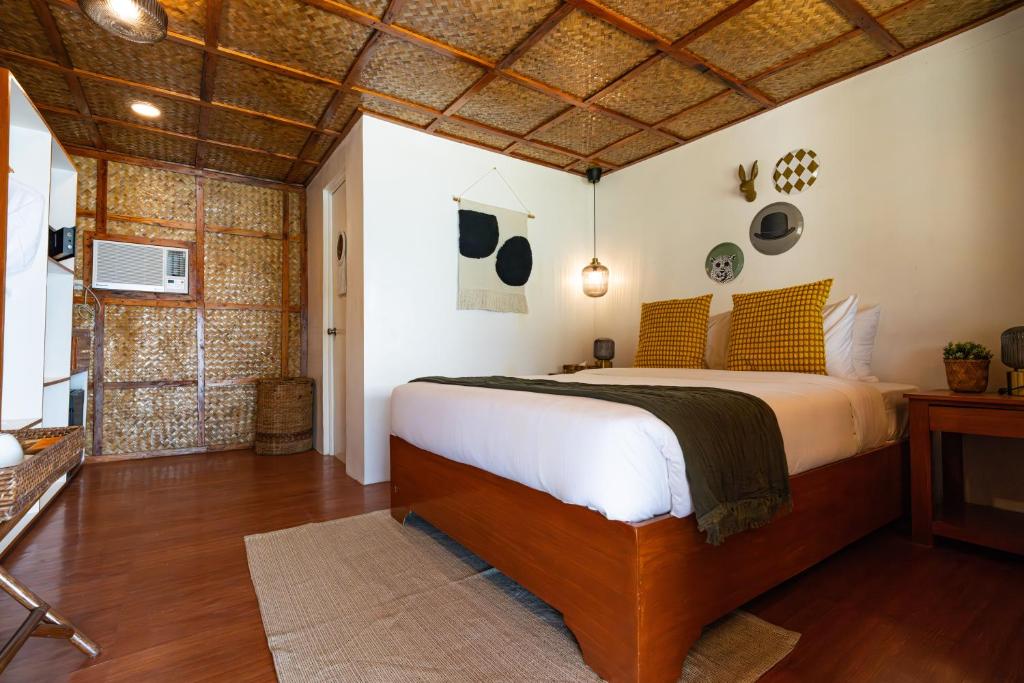 Postel nebo postele na pokoji v ubytování Beach Huts El Nido