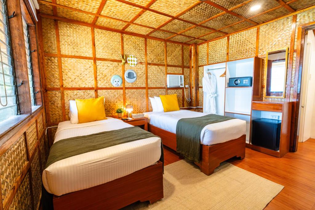 Postel nebo postele na pokoji v ubytování Beach Huts El Nido