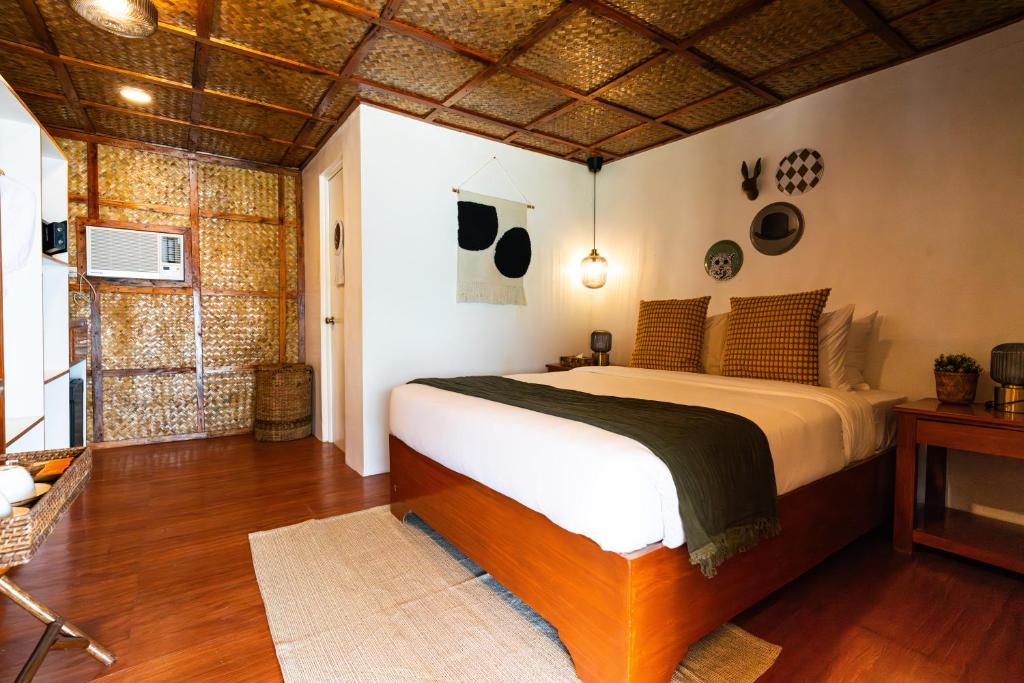 Postel nebo postele na pokoji v ubytování Beach Huts El Nido