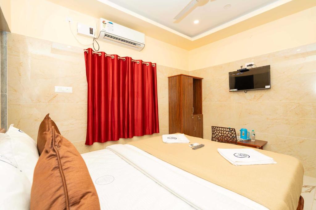 TV a/nebo společenská místnost v ubytování Amman Residency - Rameswaram