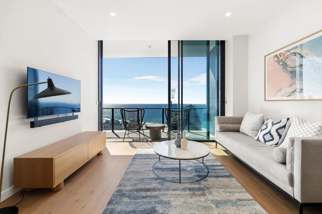 a living room with a couch and a table at CASSA CASINO - Luxury Residences Managed by The Cassa in Gold Coast