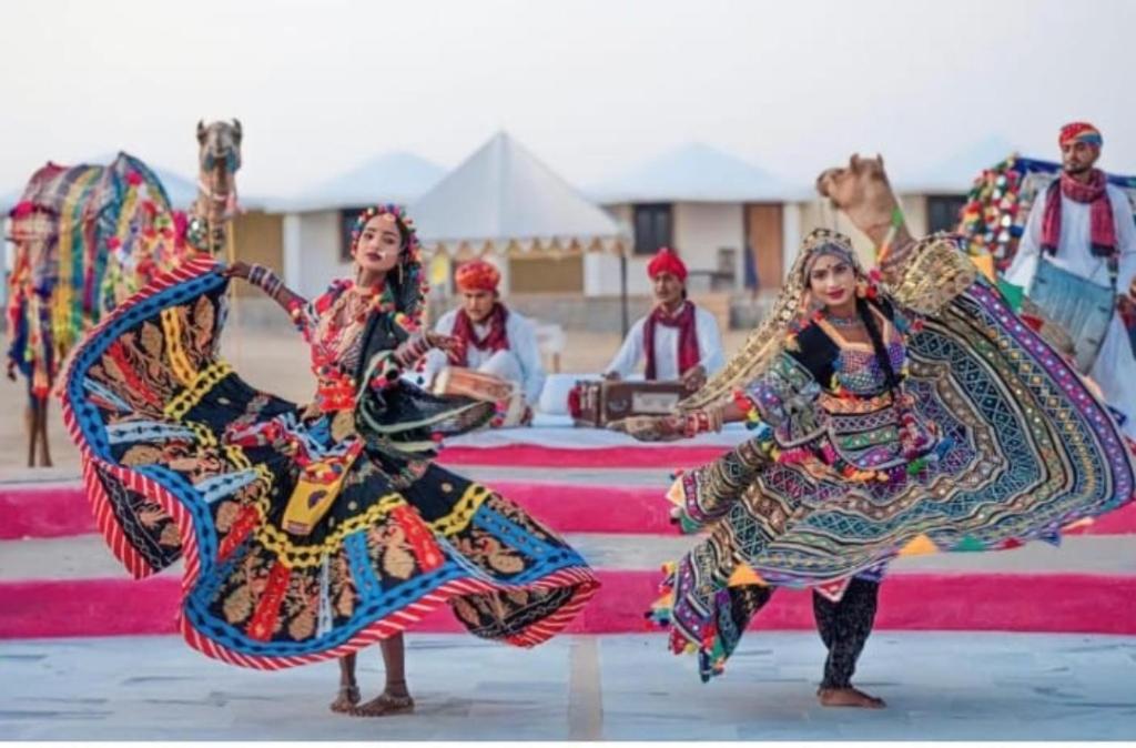 a group of women performing a dance at a festival at Royal Adventure Camp & Resort in Jaisalmer