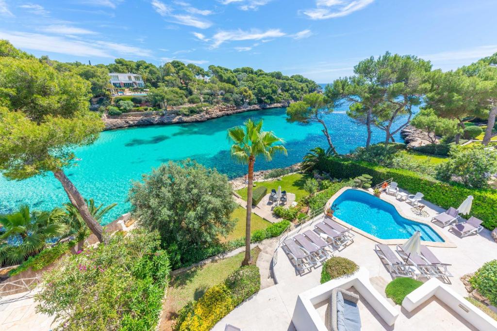 an aerial view of a river with a pool at Casa Ramon in Cala d´Or