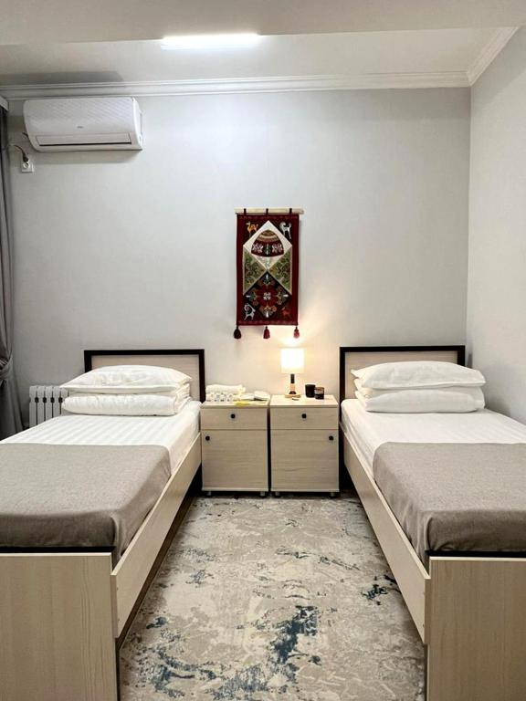 Postel nebo postele na pokoji v ubytování Compass Hostel
