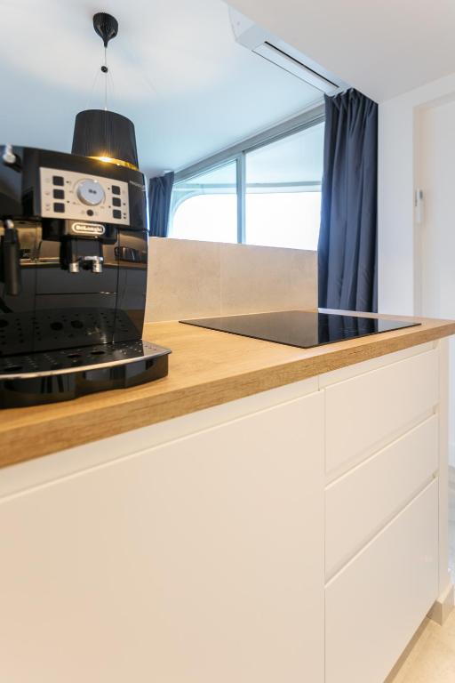 Kuchyň nebo kuchyňský kout v ubytování Comfortion Norma - Suite de luxe avec vue sur la Tour Eiffel