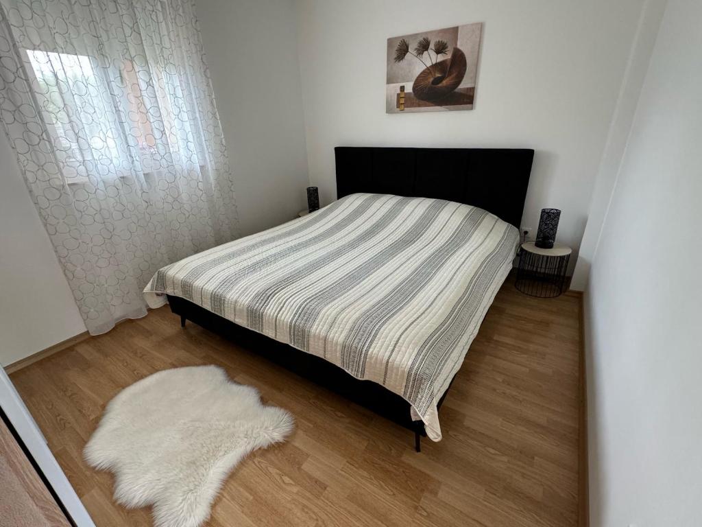 Postel nebo postele na pokoji v ubytování Apartments Elvira