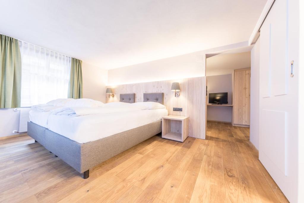 Postel nebo postele na pokoji v ubytování Hotel Sonne