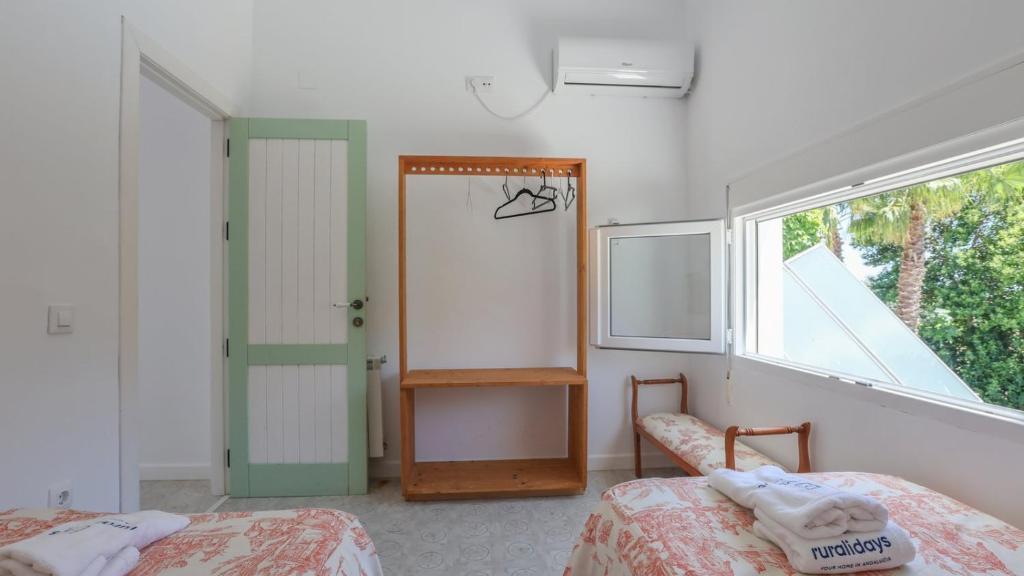 Postel nebo postele na pokoji v ubytování Casa Huerta El Fontanarillo Montemayor by Ruralidays