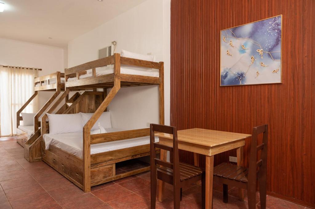 Postel nebo postele na pokoji v ubytování Costa Liz Island Resort