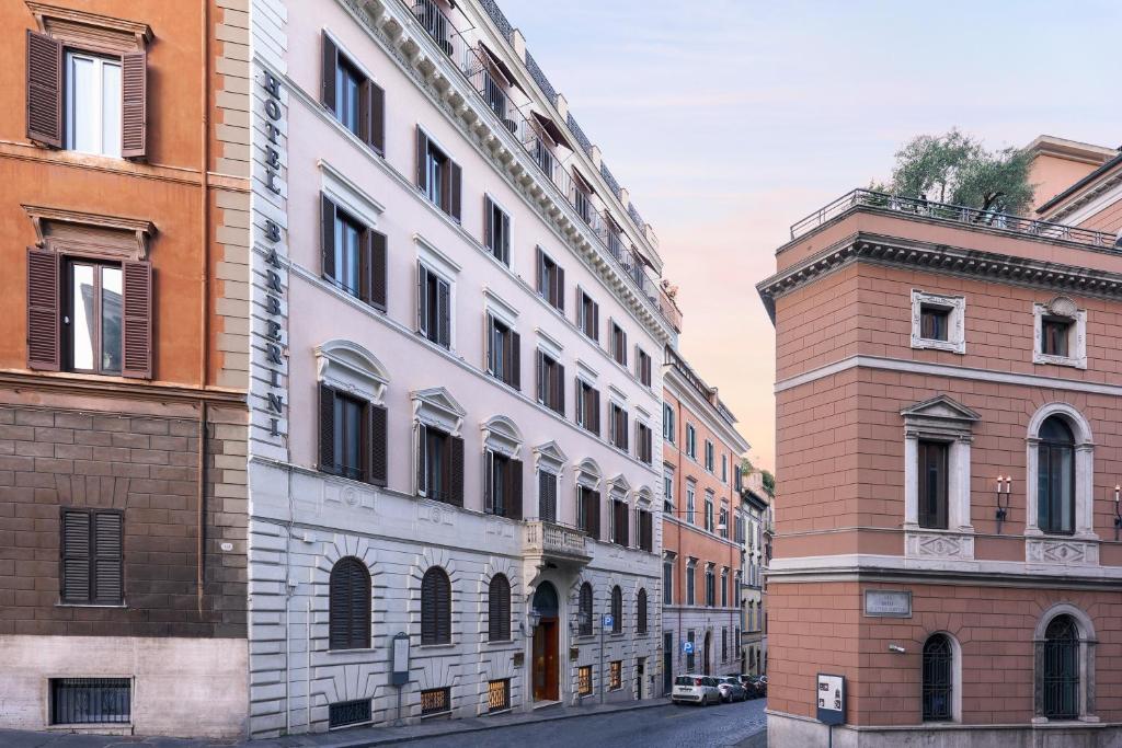 a row of buildings on a street in a city at Hotel Barberini in Rome