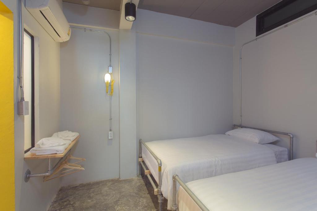 Postel nebo postele na pokoji v ubytování Bloo Hostel