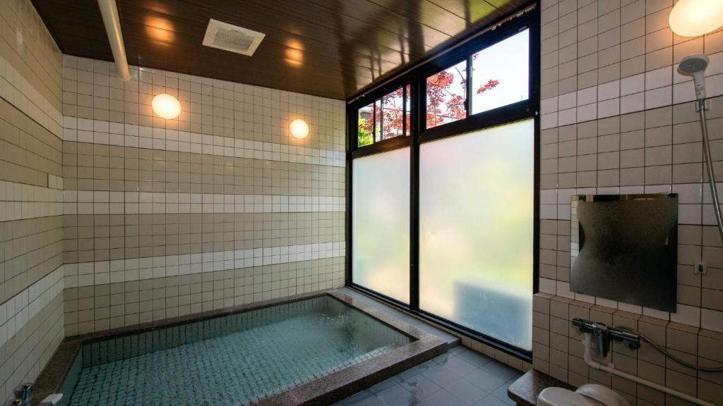 TV a/nebo společenská místnost v ubytování Onsen Urashima