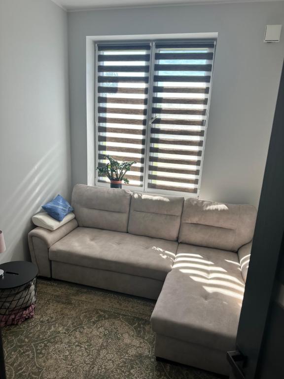 a living room with a couch and a window at Akihabara 1 in Loo
